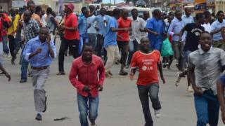 protesters running away from police during protests in Bujumbura