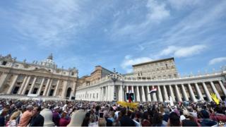 A general view shows Pope Francis addressing the crowd from the window of the apostolic palace overlooking St Peter's square