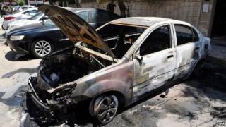 Car damaged by suicide bomb explosion in Damascus, Syria (4 May 2015)