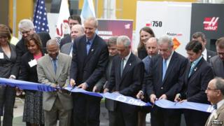 Men opening the Digital Manufacturing and Design Innovation Institute