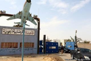 Members of forces loyal to Libya's Islamist-backed parliament General National Congress (GNC) secure al-Ghardabiya airbase as they fight Islamic State (IS) group jihadists on the outskirts of Libya's western city of Sirte on March 16, 2015