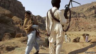 A rebel stands guard at a camp in the province of Balochistan, Pakistan on January 22, 2006