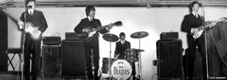 The Beatles onstage at the King's Hall in 1964
