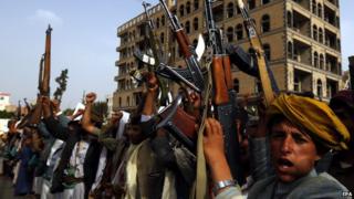 Armed Houthi supporters shout anti-Saudi slogans during a rally in Sanaa on 5 June 2015
