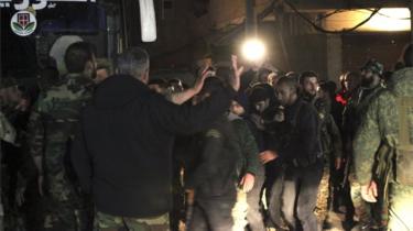 Some 13 fighters from besieged Eastern Ghouta in the countryside of Damascus, Syria, are transported on a government bus on 9 March 2018