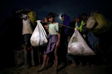 Rohingya Muslims continue their journey after crossing the Myanmar Bangladesh border at Palong Khali, Bangladesh, 1 November 2017.