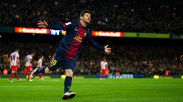 Footballer Lionel Messi celebrates scoring a goal for his side, Barcelona
