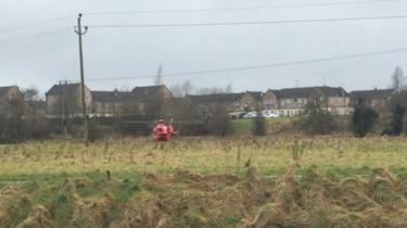 An air ambulance has arrived close to the search area