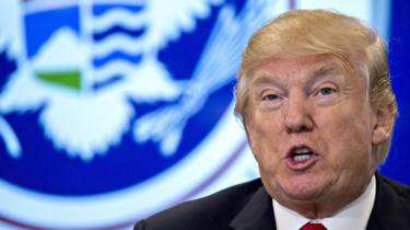 President Donald Trump speaks while touring the CBP National Targeting Center in Sterling, Virginia, 2 February 2018