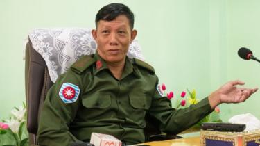 Colonel Phone Tint, Rakhine Border Security Minister, seated and dressed in green military fatigues