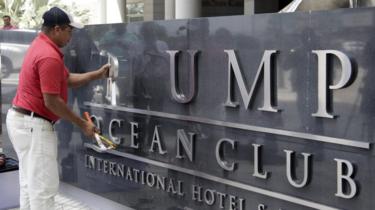 A worker changes the Trump Ocean Club Hotel's sign in Panama City, Panama, 5 March 2018