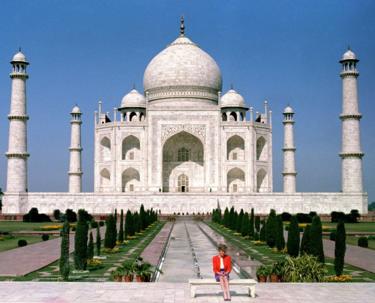 The Princess of Wales sits in front of the Taj Mahal alone, during a Royal tour of India on 11 Feb 1992