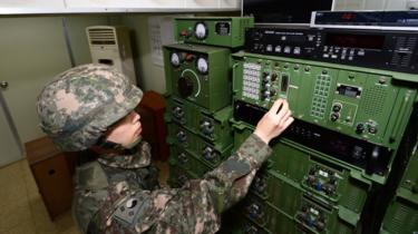 A South Korean soldier operates the loudspeakers (file image)