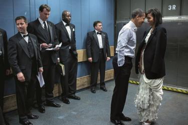 Obama kisses Michelle in a lift