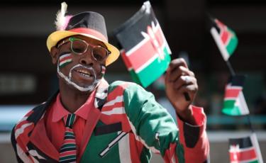 People wave Kenyan flags during the Independence Day ceremony, called Jamhuri Day ("Republic" in Swahili) at Kasarani stadium in Nairobi, Kenya, on December 12, 2017.