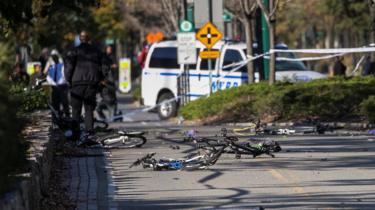 Several bikes are seen crushed along a bike path in Lower Manhattan.