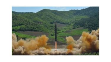 North Korea launches a Hwasong-14 missile, according to its KCNA news agency, in a photo dated 4 July, 2017