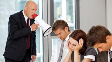 A boss using a megaphone