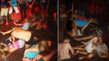 A police handout picture of people appearing to imitate sex acts at a party