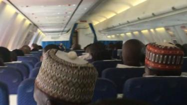 Passengers on a flight in Nigeria