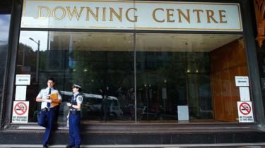 Two police officers stand outside Sydney's Downing Centre, where the trial was held.