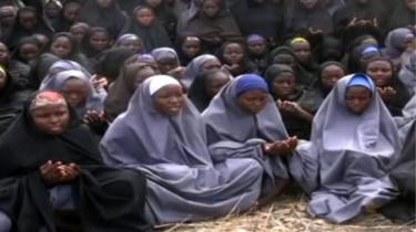 A screengrab taken on May 12, 2014, from a video of Nigerian Islamist extremist group Boko Haram obtained by AFP shows girls, wearing the full-length hijab and praying in an undisclosed rural location.