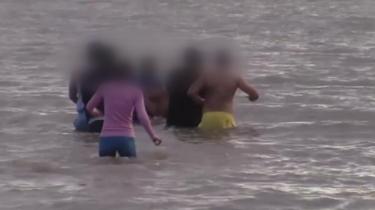 A mass baptism ceremony at Jackson Bay, Vale of Glamorgan