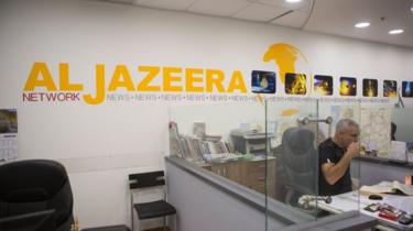 Employees of Al Jazeera satellite channel, work at their Jerusalem bureau, Israel, 14 June 2017