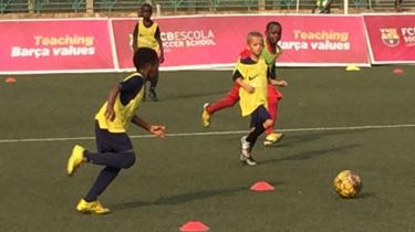 Group of children playing football at the Barcelona Lagos Academy inside the Teslim Balogun Stadium Complex in Surulere.