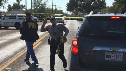 FBI officials arrive at the site of a mass shooting in Sutherland Springs, Texas
