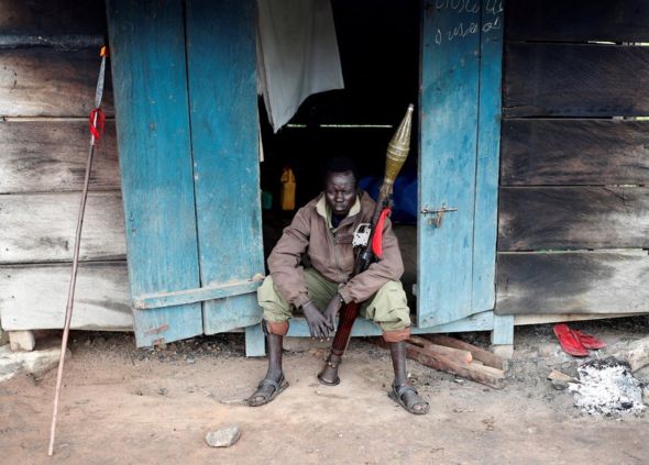 A rebel soldier posing with his weapon
