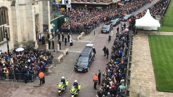 Aerial view of hearse arriving at Great St Mary's Church in Cambridge