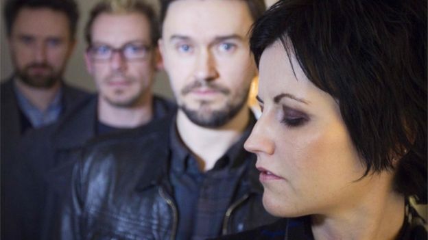 This file photo taken on January 18, 2012 shows the members of the Irish rock band The Cranberries, singer Dolores O"Riordan (R), bassist Mike Hogan (2ndR), drummer Fergal Lawler (2ndL) and guitar player Noel Hogan (L) pose on January 18, 2012 in Paris