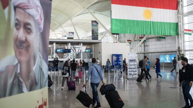 People are seen inside Irbil International Airport on 27 September 2017