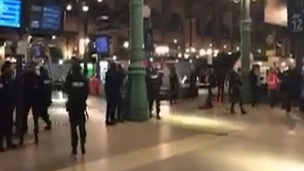 Still image taken from video shows police officers at the Paris' Gare du Nord train station