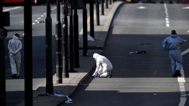 Police forensic investigators working on London Bridge on Sunday morning