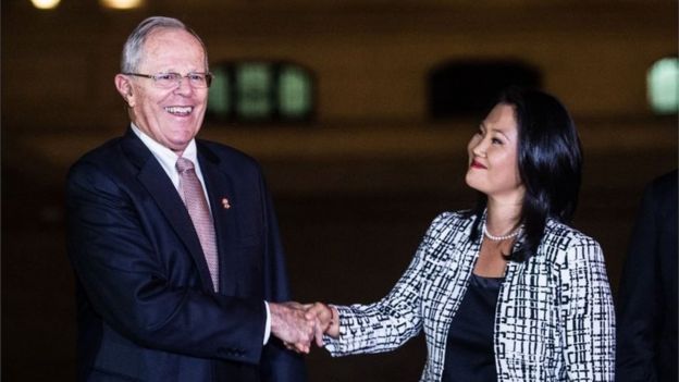 This file picture taken on July 11, 2017 shows Peru"s President Pedro Pablo Kuczynski (2-L) shaking hands with the leader of Fuerza Popular party, Keiko Fujimori (2-R) after a private meeting at the Peruvian Governement Palace in Lima