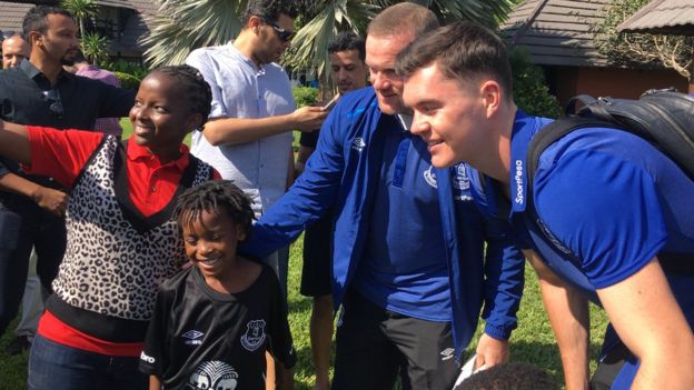 Everton players pose for a selfie with fans in Tanzania