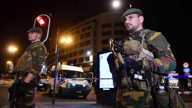 Armed police stand guard outside Brussels Central train station