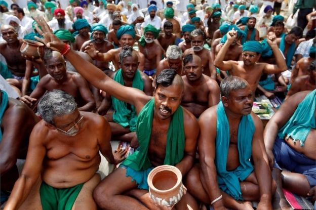 Farmers from the southern state of Tamil Nadu pose half shaved during a protest demanding a drought-relief package from the federal government, in New Delhi, India April 3, 2017