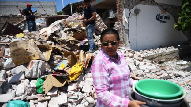 People search rubble for their belongings in clean-up operation