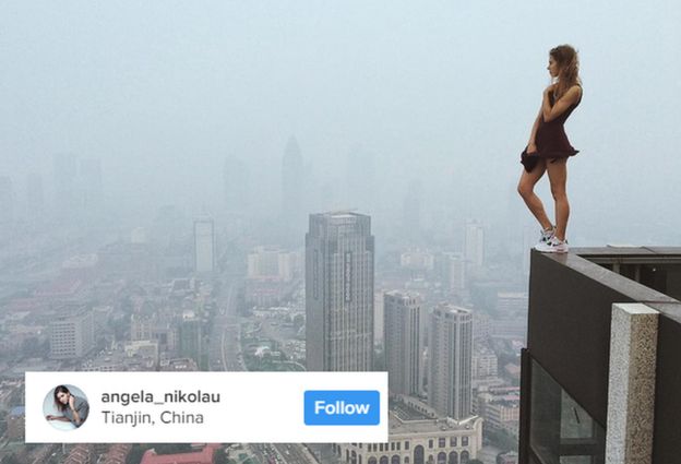 Angela Nikolau standing on the edge of a building in China