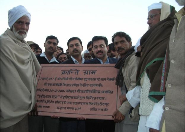 Presentation of memorial stone to the village