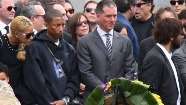 Singer Pharrell Williams (second on the left) and his spouse Helen Lasichanh (left) attended the memorial service