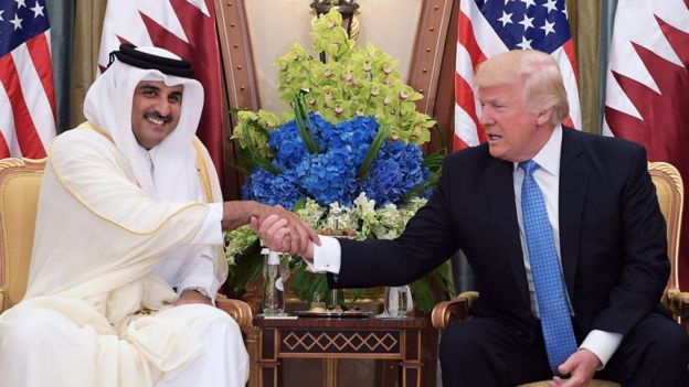 This file photo taken on May 21, 2017 shows US President Donald Trump (R) shaking hands with Qatar