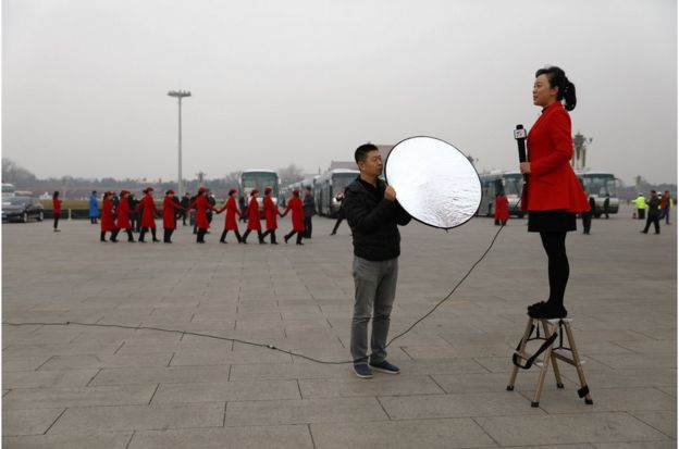 A Chinese TV journalist makes her report on Tiananmen Square during the opening of the 1st Session of the 13th Chinese People"s Political Consultative Conference (CPPCC) National Committee at the Great Hall of the People (GHOP) in Beijing, China, 03 March 2018. The CPPCC is the top advisory body of the Chinese political system and runs alongside the annual plenary meetings of the 13th National People"s Congress (NPC), together known as "Lianghui" or "Two Meetings". EPA/HOW HWEE YOUNG