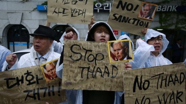 South Korean protesters shout slogans such as 