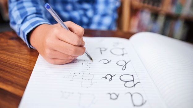Boy practising handwriting