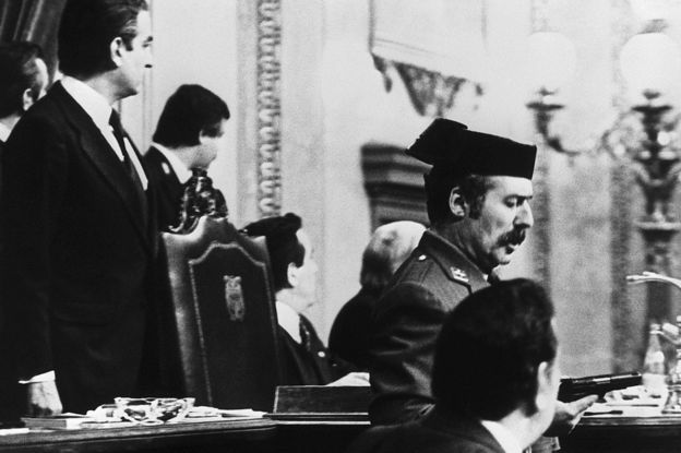 Lt-Col Antonio Tejero de Molina (C) brandishes his pistol in the Spanish parliament, 23 February 1981