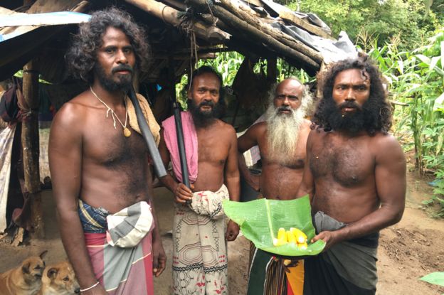 Poramal Aththo (right) and fellow members of the Rathugala Veddha community